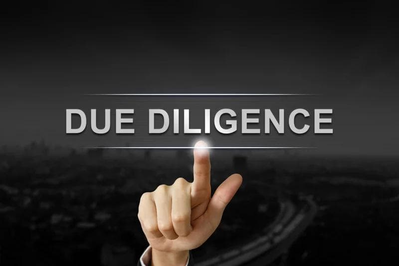 Due diligence words with pointing finger